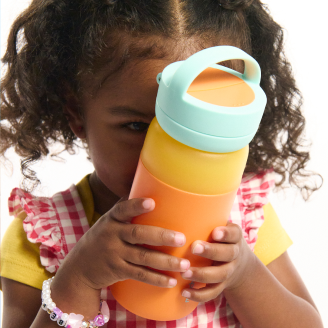 Child with Orange water bottle with a light blue cap on a white background