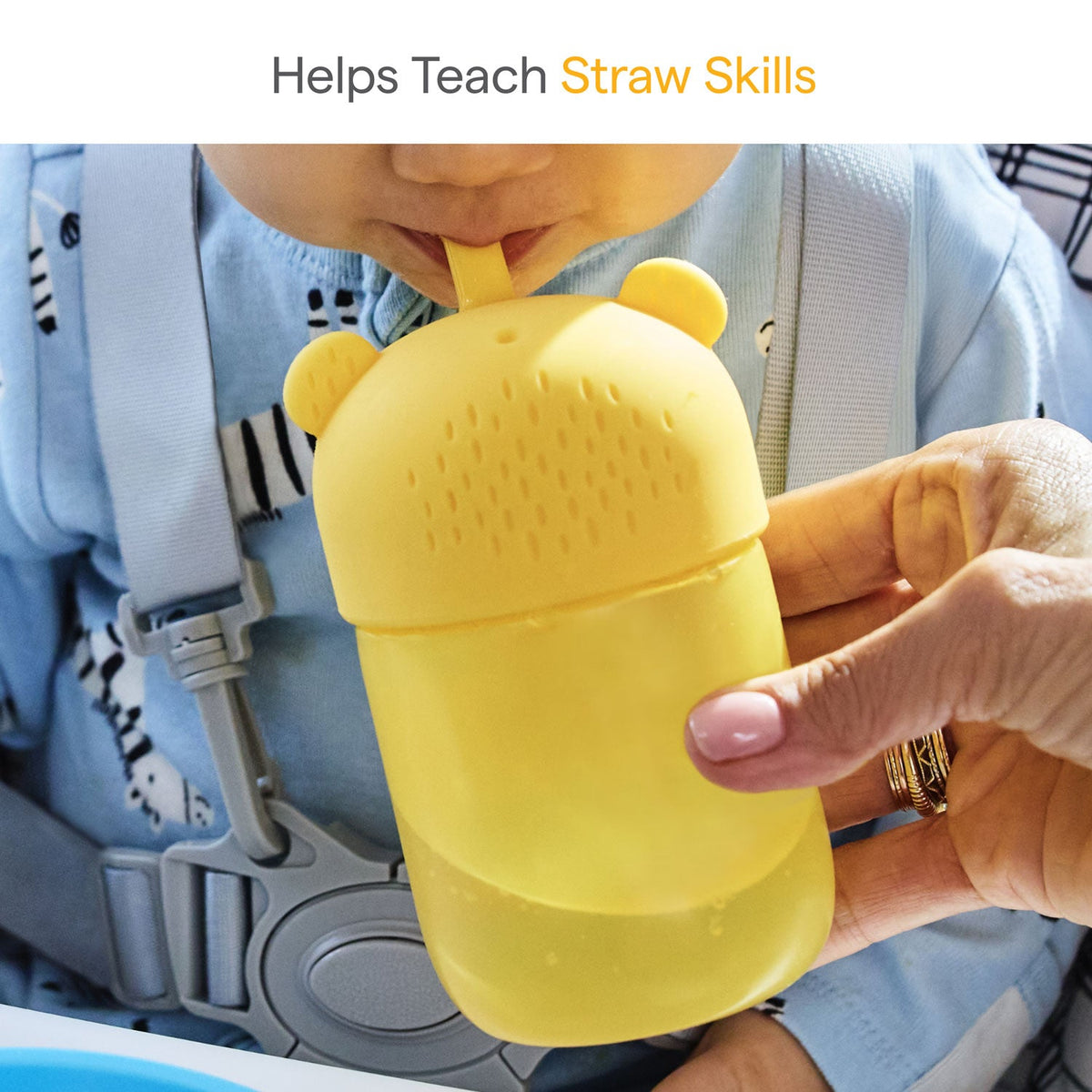 Yellow cup with a straw held by a child in a car seat, labeled 'Helps Teach Straw Skills'.