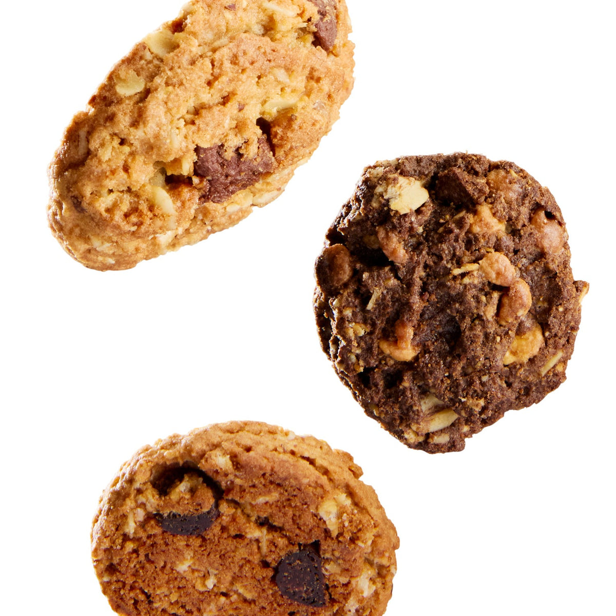 Three cookies with chocolate chips and nuts on a white background