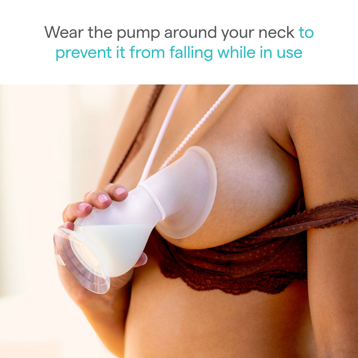 Silicone breast pump worn around a person's neck with text on a light background